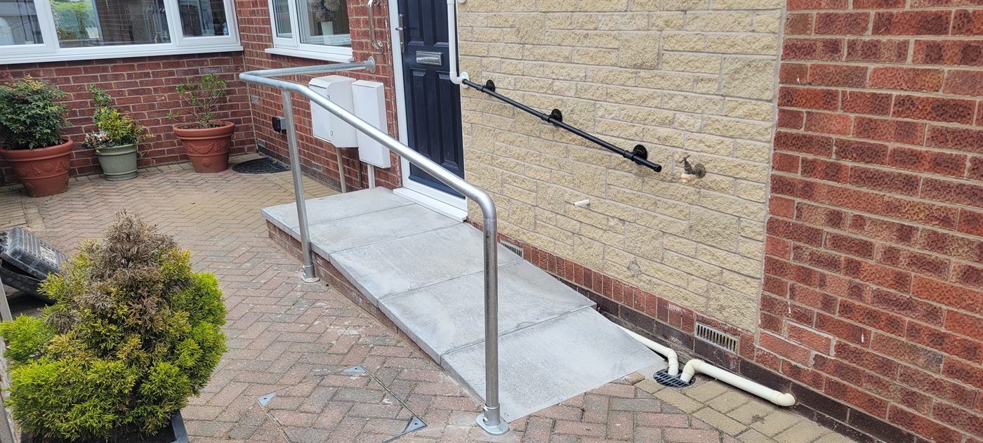 Steel handrail fitted beside a doorway ramp in Doncaster