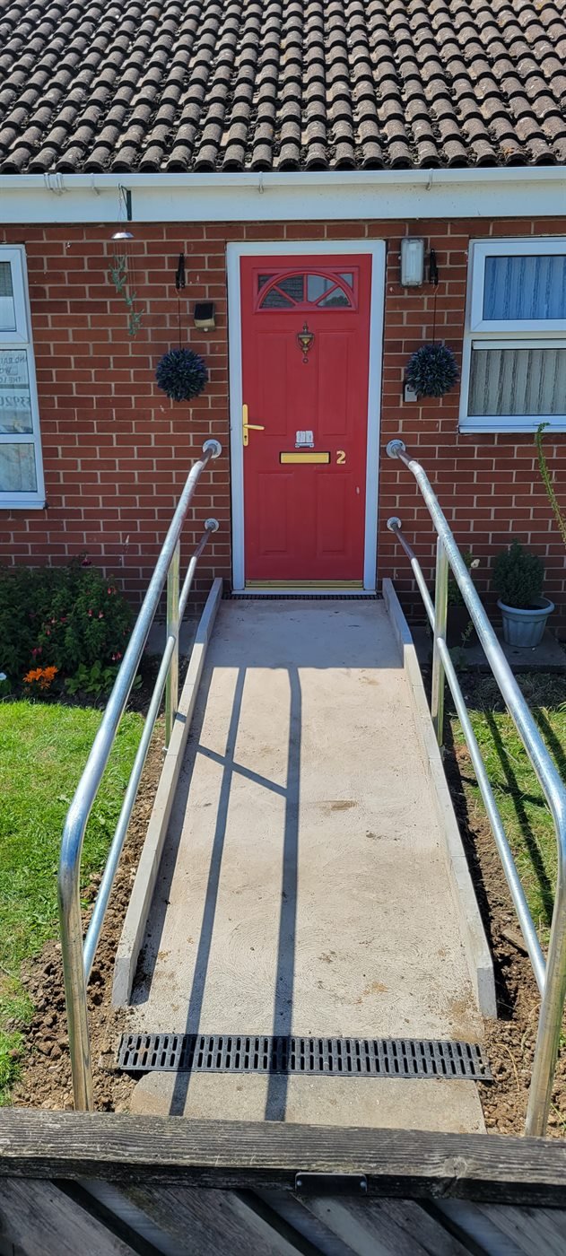 Steel handrail fitted to a domestic access ramp