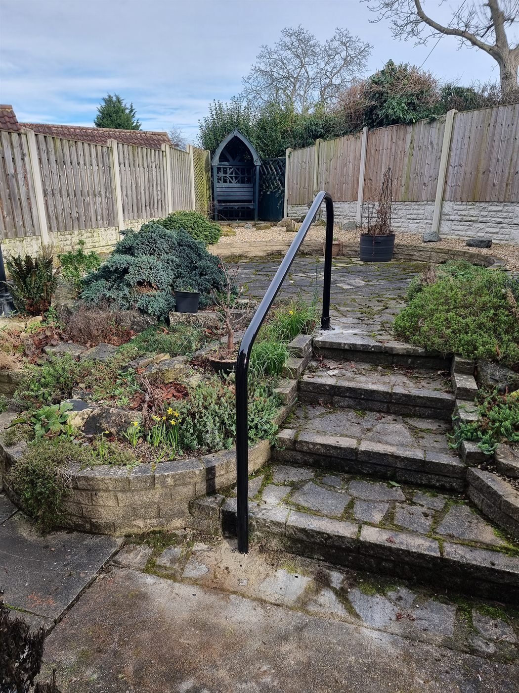 Steel handrail fitted on a sloped access path