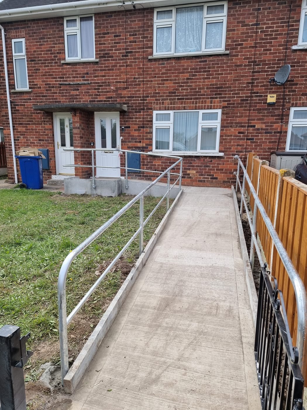 Steel handrail fitted beside a domestic pathway